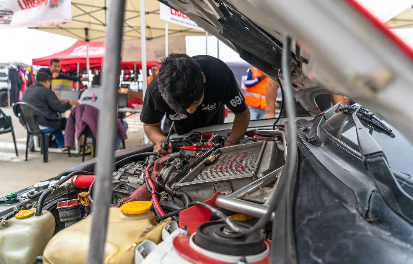 Technician working in an engine bay