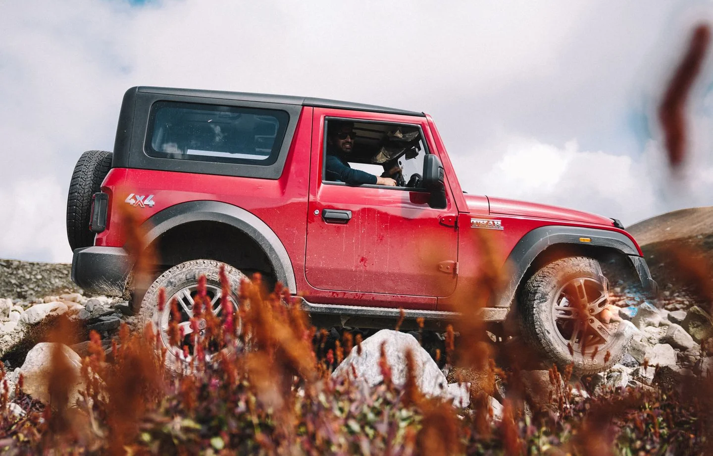 Four-wheel-drive vehicle on a rugged track