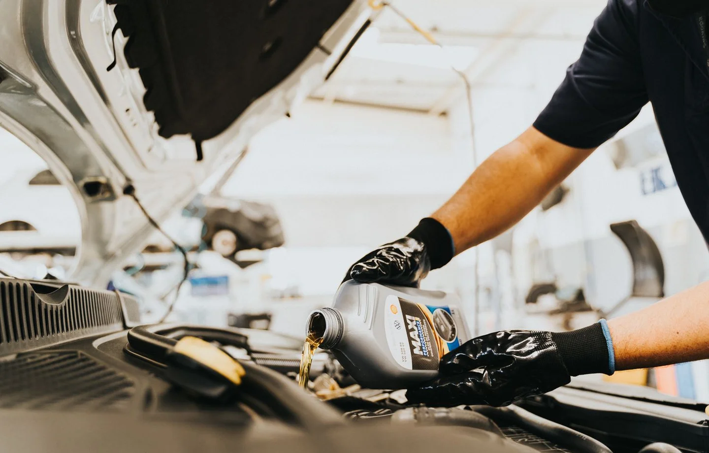 Engine oil being poured during servicing